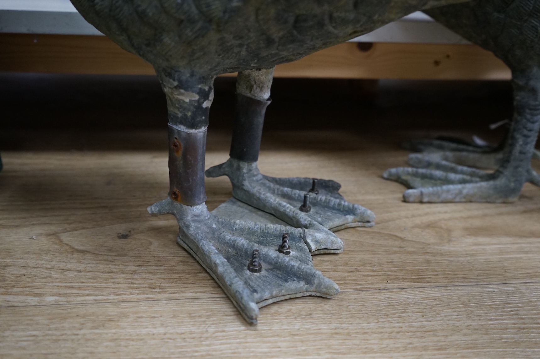 A pair of silvered metal ‘geese’, 70cm
